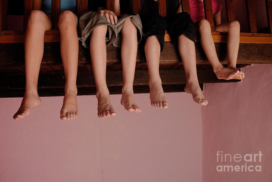 Four children on mezzanine Photograph by Sami Sarkis