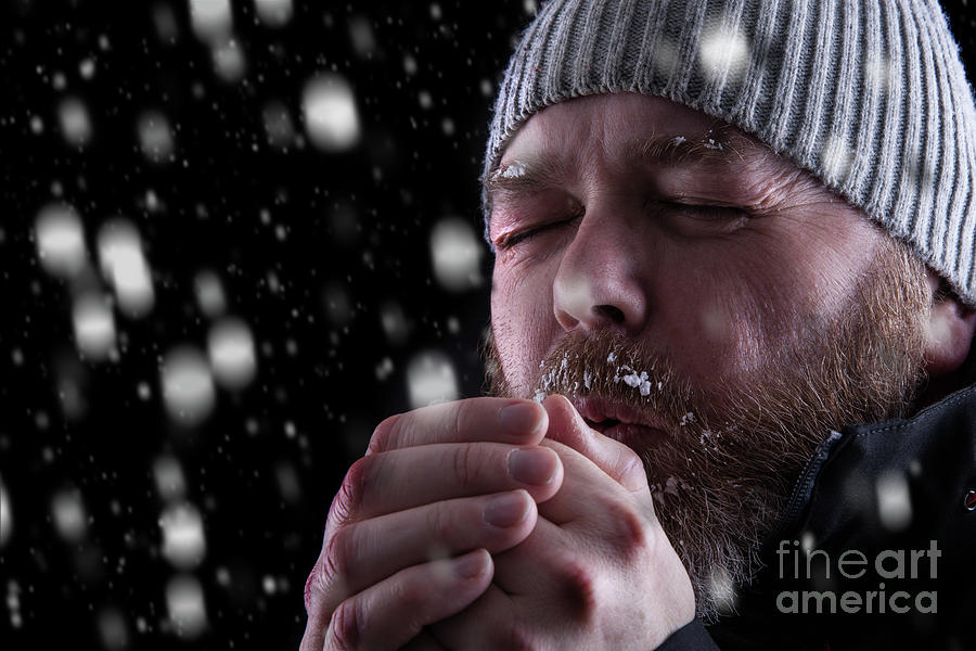 Freezing cold man in snow storm Photograph by Simon Bratt