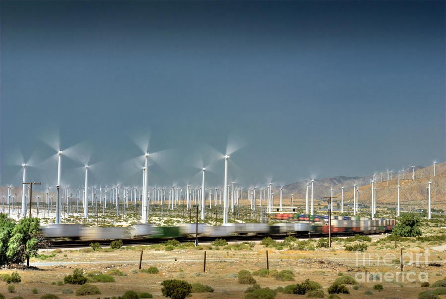 Freight train moving Palm Springs desert Wind Farm Turbines Photograph by David Zanzinger