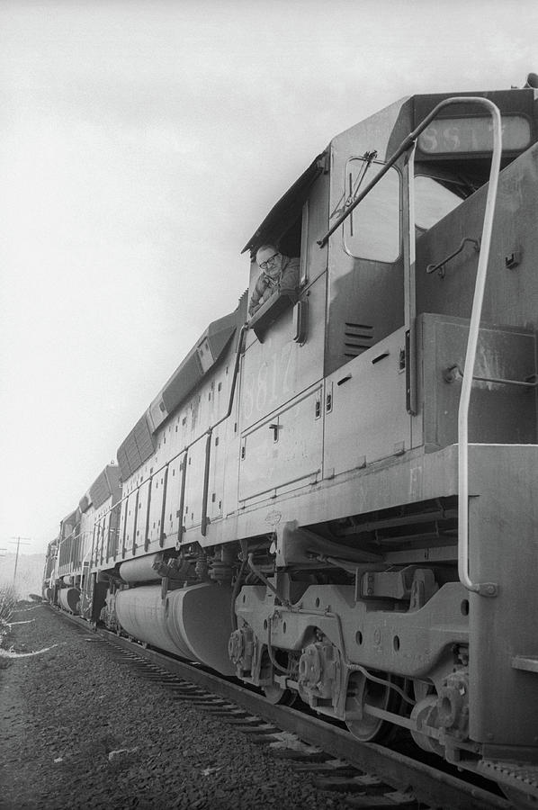 Freight train parked on siding. by Frank DiMarco Freight train parked on siding. by Frank DiMarco