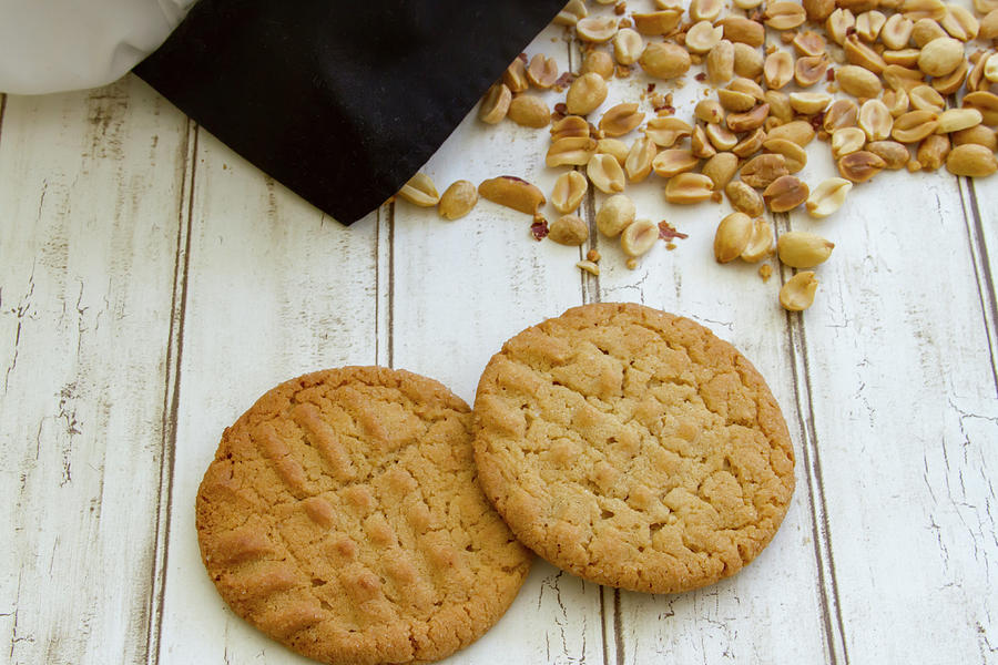 Fresh baked peanut butter cookies with chefs hat Photograph by Karen Foley