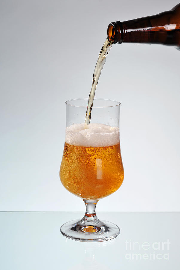 Beer Photograph - Fresh beer filling glass on stem  by Arletta Cwalina