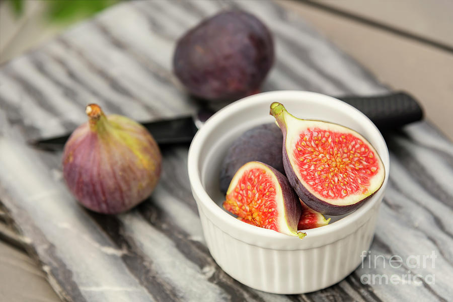 Fresh cut figs on table Photograph by Sophie McAulay