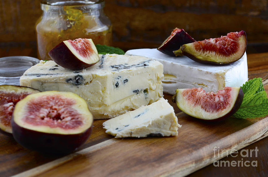 Fresh Figs and cheese on Dark Wood Table Setting.  Photograph by Milleflore Images