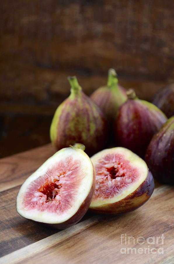 Fresh Figs on Dark Wood Table Setting.  Photograph by Milleflore Images