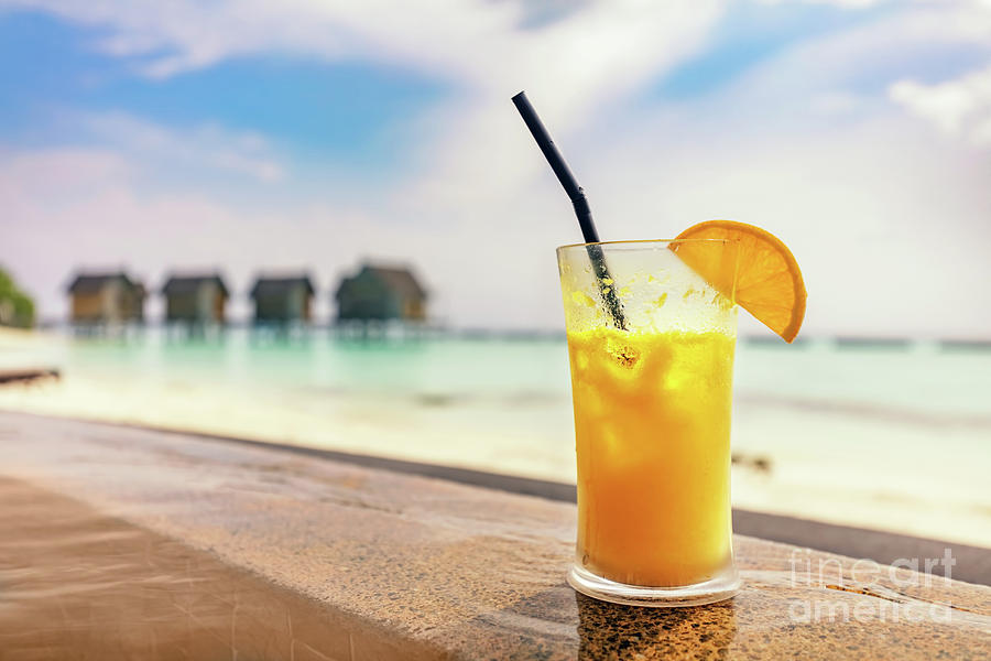 Fresh orange juice by the poolside. Tropical island in Maldives Photograph by Michal Bednarek