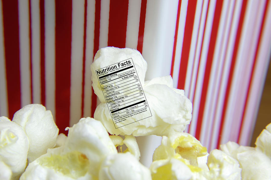 Fresh popped popcorn with nutritional label Photograph by Karen Foley