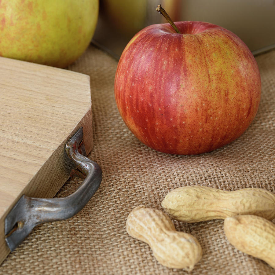 Fresh Red Apple And Peanuts Photograph