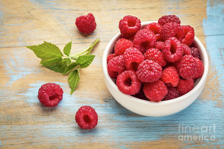 Fresh Red Raspberries With Green Leaf Photograph by Marek Uliasz