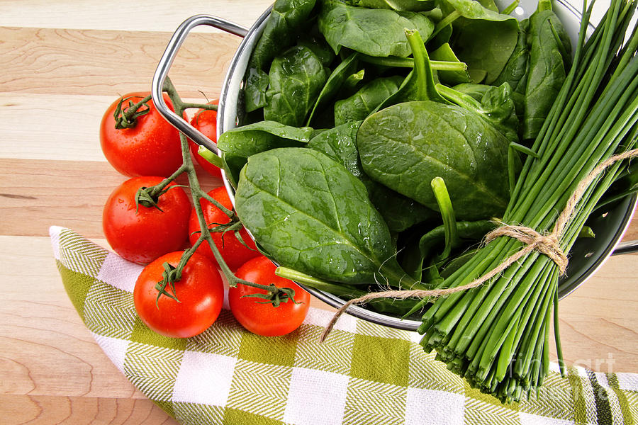 Fresh spinach leaves with tomatoes and strainer Photograph by Sandra Cunningham