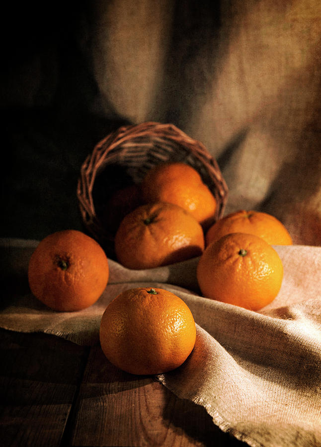 Fresh tangerines in brown basket Photograph by Jaroslaw Blaminsky