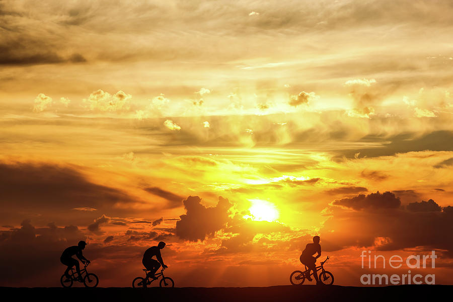 Friends on a bike trip at sunset. Active lifestyle, cycling hobby. Photograph by Michal Bednarek