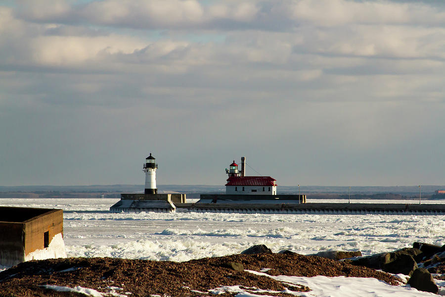 Frozen Lake Superior rocky shoreline with The Crib, lighthouses ...