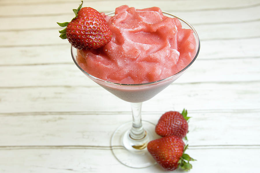 Frozen strawberry smoothie with berry in frosty glass. Photograph by Karen Foley