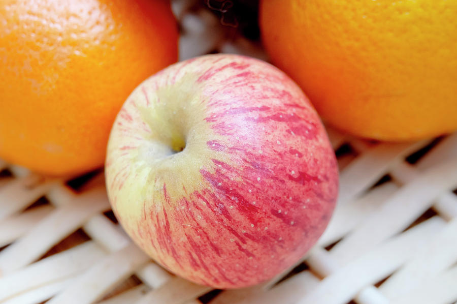 Fruit basket. Apple and oranges. Photograph by Elena Perelman