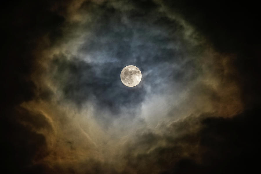 Full moon behind clouds Photograph by Kathleen McGinley