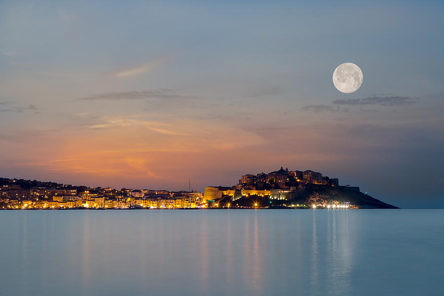 Full moon over Calvi citadel in Balagne region of Corsica Photograph by Jon Ingall