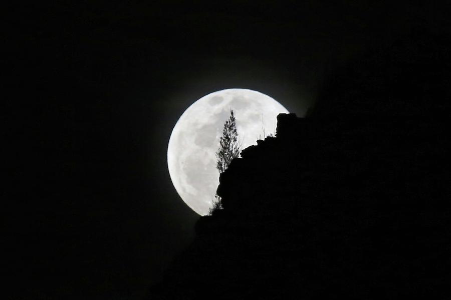Full moon rising over Makapuu Photograph by M C Hood