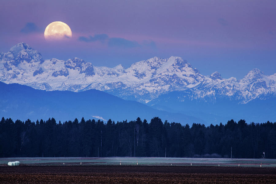 Full Moon setting over the Julian Alps Photograph by Ian Middleton