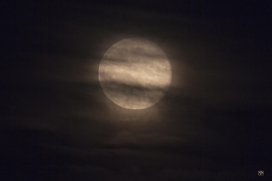 Full Moon through Clouds Photograph by John Meader