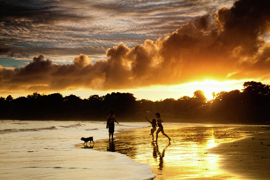 Sunset Photograph - Fun at the Beach by Iris Greenwell