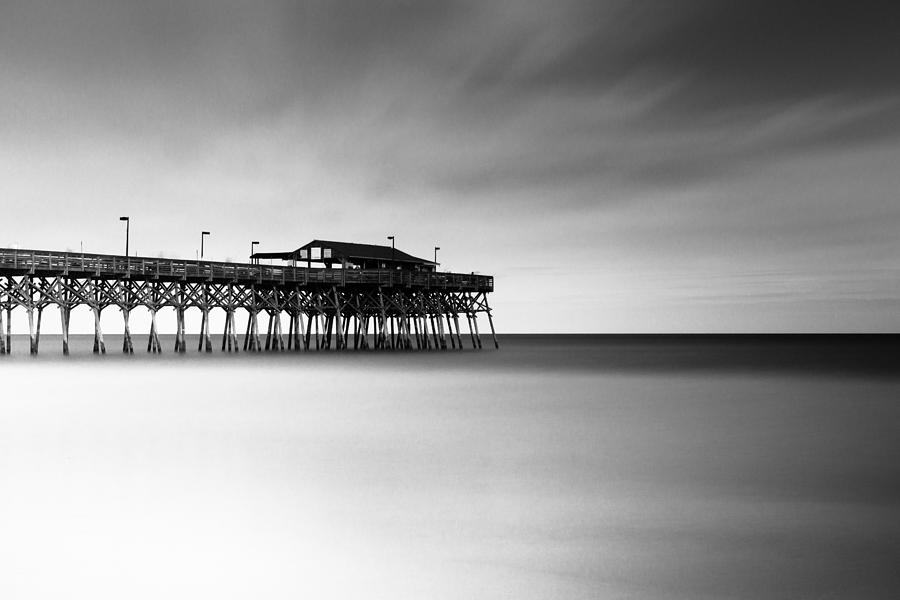 Black And White Photograph - Garden City Pier BW I by Ivo Kerssemakers
