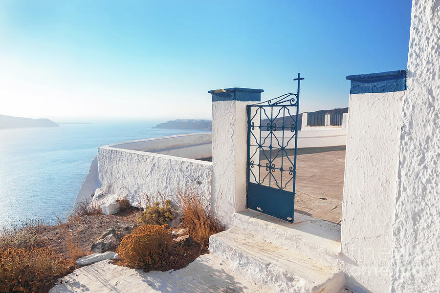 Gate to a church in Fira on Santorini island, Greece. Aegean sea view Photograph by Michal Bednarek