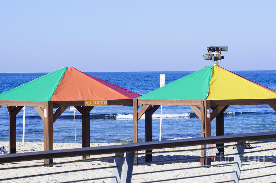 Gay rainbow flag colours on a beach in Tel AviV Photograph by Ilan Rosen