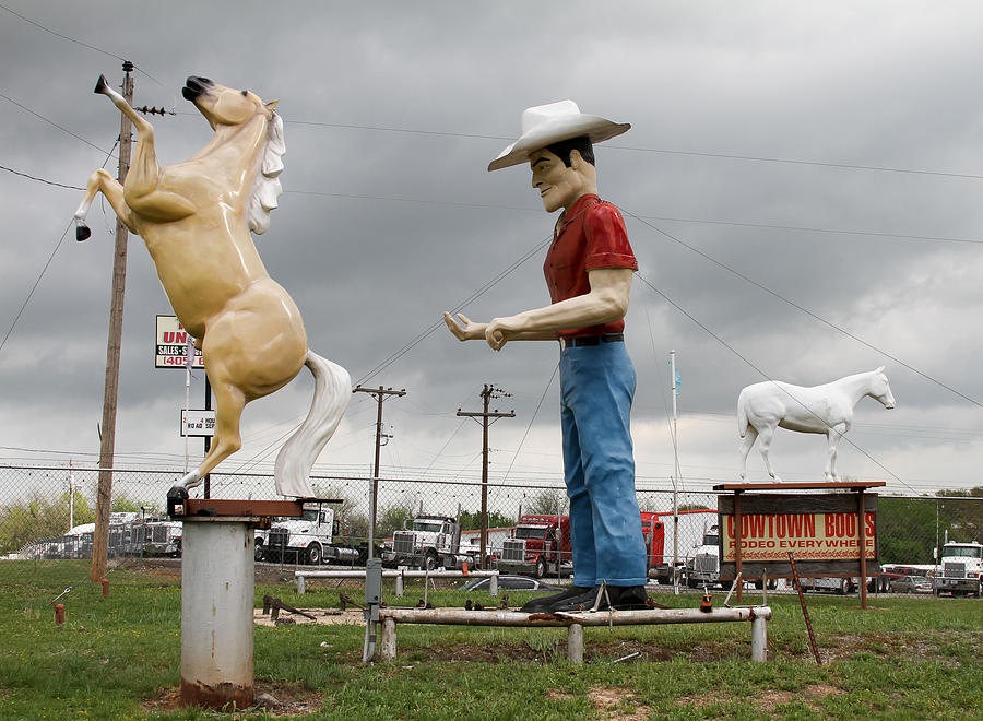 Giant Cowboy and Horses Photograph by Tony Grider