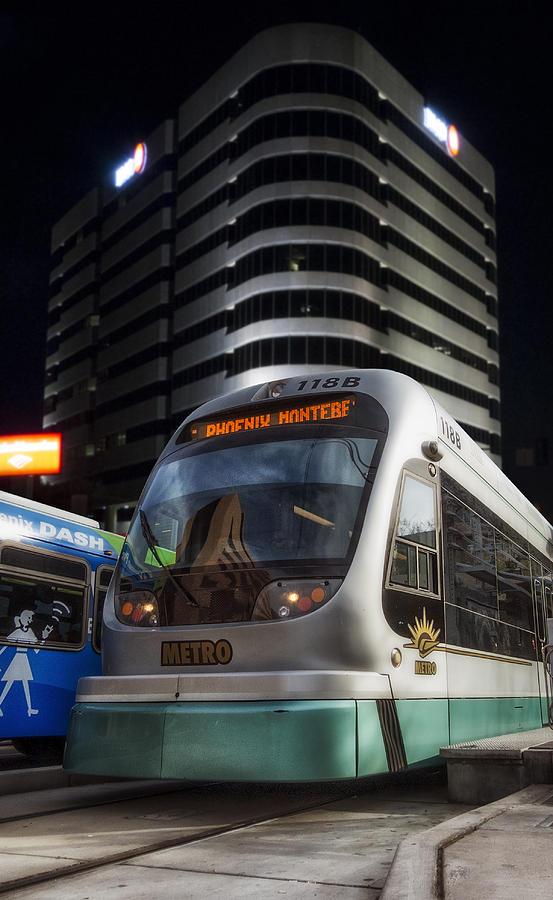 The Metro light rail train night image Photograph by Gary Warnimont