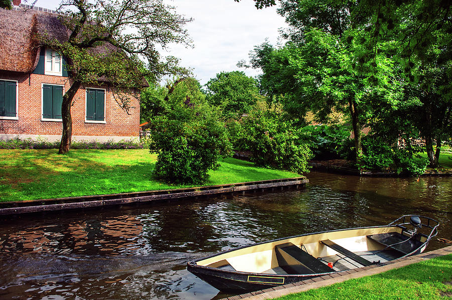 Giethoorn Scene with Boat and Cottage. The Netherlands Photograph by Jenny Rainbow