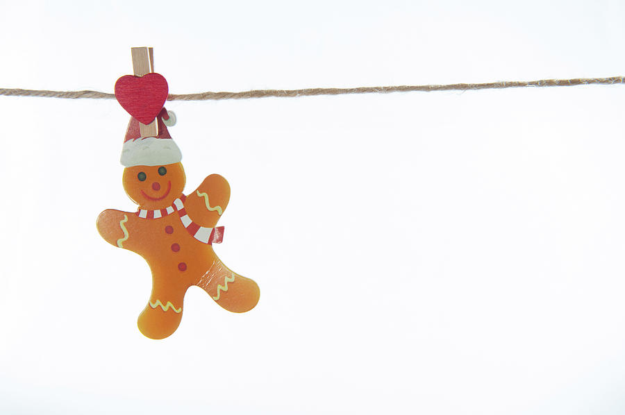 Gingerbread man on a line Photograph by Helen Jackson