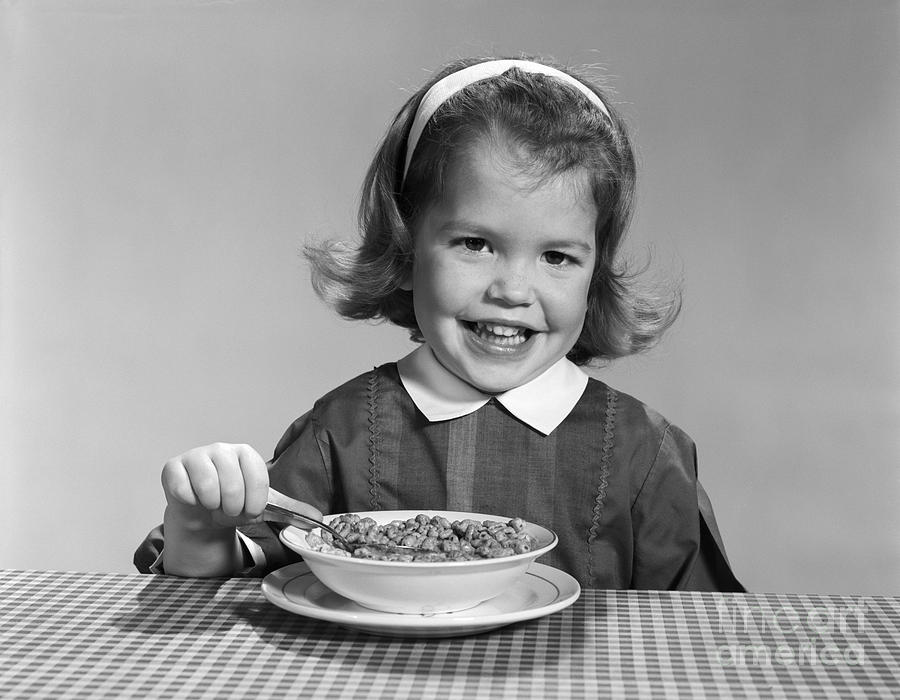 Girl Eating Cereal, C.1950-60s Photograph by H. Armstrong Roberts/ClassicStock