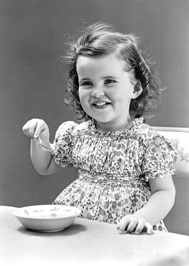 Girl Eating Ice Cream, C.1940-30s Photograph by H. Armstrong Roberts/ClassicStock