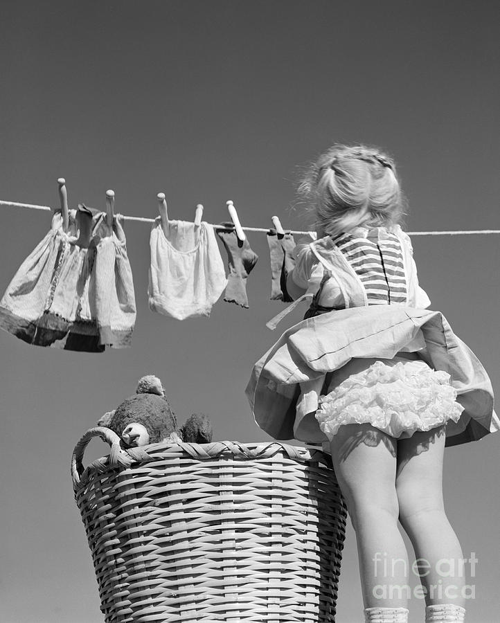 Girl Hanging Laundry, C.1950s Photograph by D. Corson/ClassicStock