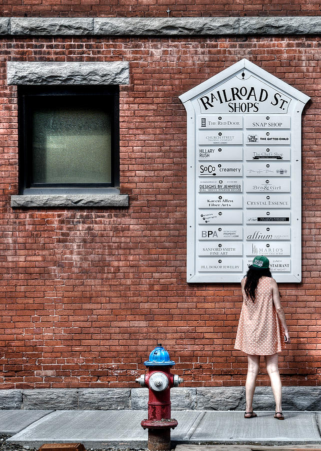 City Photograph - Walking on Railroad Street No. 3 - The Girl in the Polka Dot Dress by Geoffrey Coelho