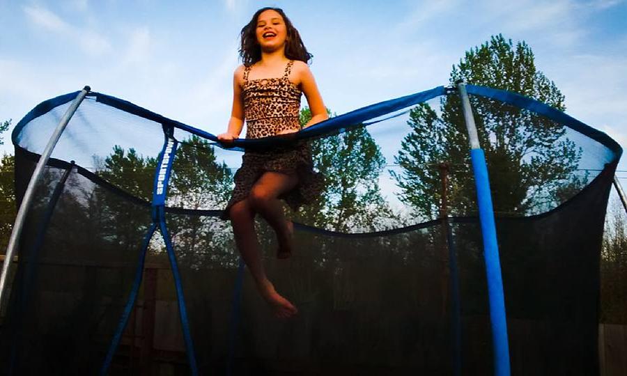 Girl On Trampoline Photograph By Shanhan Truitt Roos