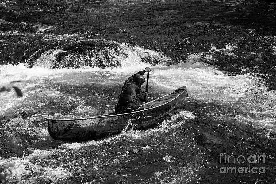 Girl paddling an open canoe in rapids Photograph by Les Palenik