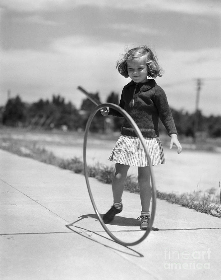 Girl Playing With Hoop And Stick Photograph by H. Armstrong Roberts/ClassicStock