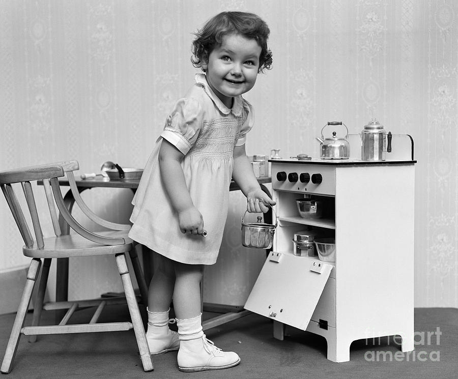 Girl Playing With Toy Kitchen Set Photograph by H. Armstrong Roberts/ClassicStock