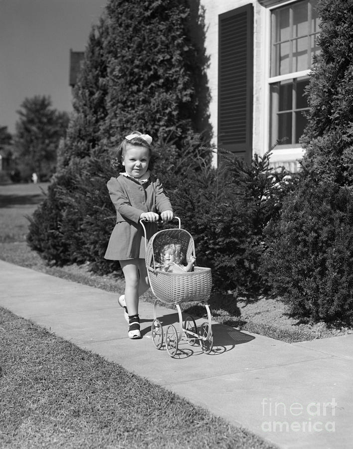 Girl Pushing Doll In Stroller, C.1940s Photograph by H. Armstrong Roberts/ClassicStock