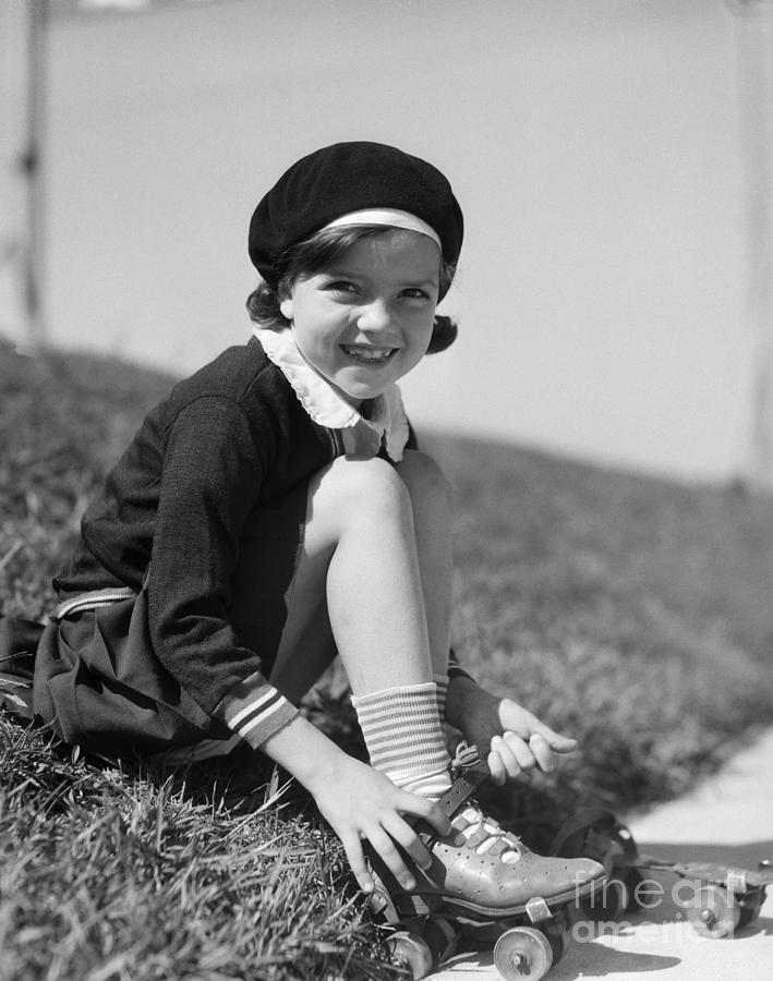 Portrait Photograph - Girl Putting On Roller Skates, C.1930s by H. Armstrong Roberts/ClassicStock