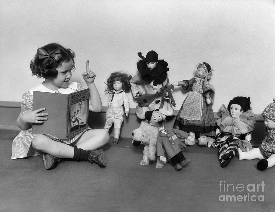 Girl Reading To Her Toys, C.1930s Photograph by H. Armstrong Roberts/ClassicStock