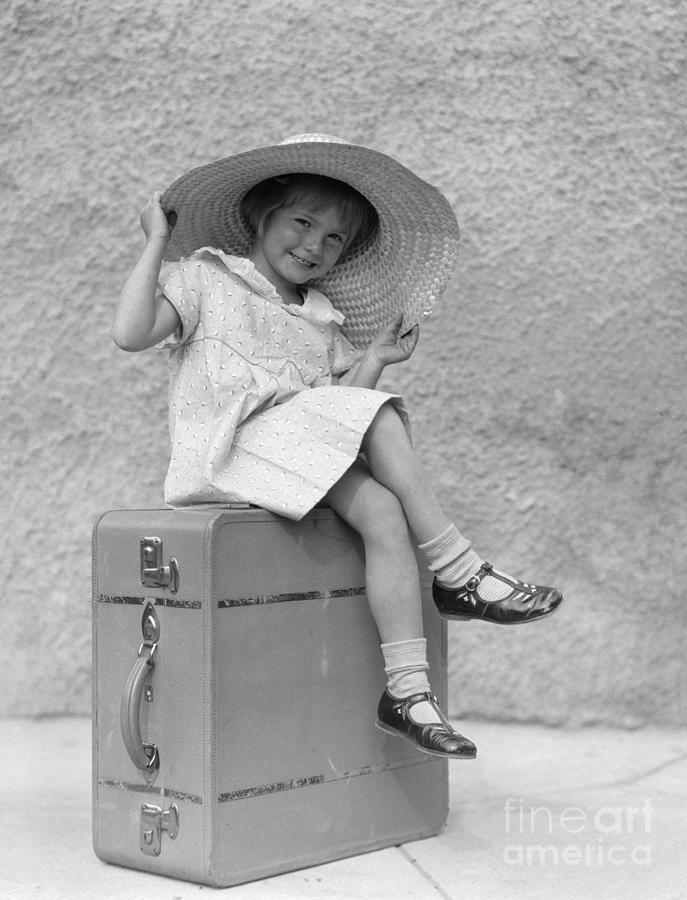 Girl Sitting On Suitcase With Big Straw Photograph by H. Armstrong Roberts/ClassicStock