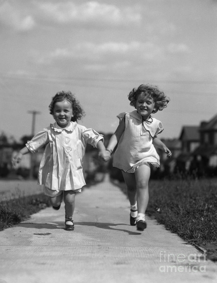Girls Running On Sidewalk, C.1930s Photograph by H. Armstrong Roberts/ClassicStock
