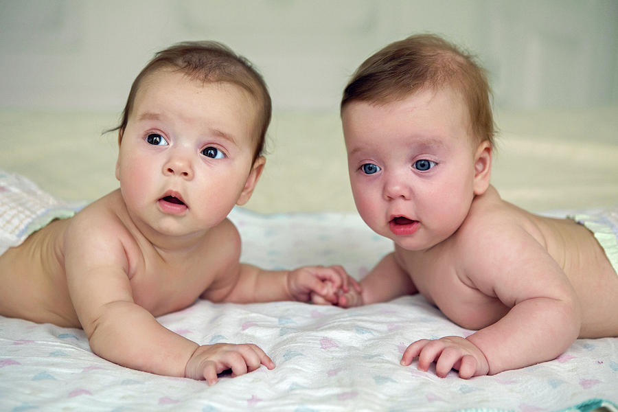 Girls Twins In Diapers Lie On The Bed Photograph by Elena Saulich ...