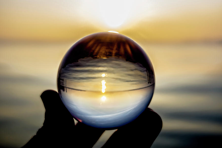 Glass ball on the lake at sunrise Photograph by Sven Brogren
