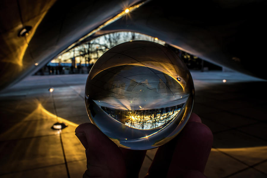 Glass ball under Chicagos Cloudgate Photograph by Sven Brogren