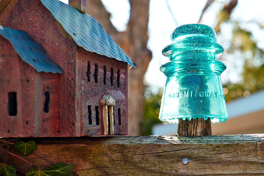 Glass Insulator and bird feeder Photograph by Scott Hales