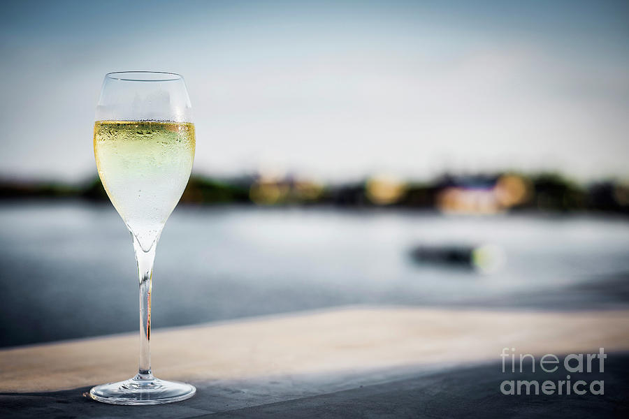 Glass Of Champagne At Modern Outdoor Bar At Sunset Photograph by JM Travel Photography